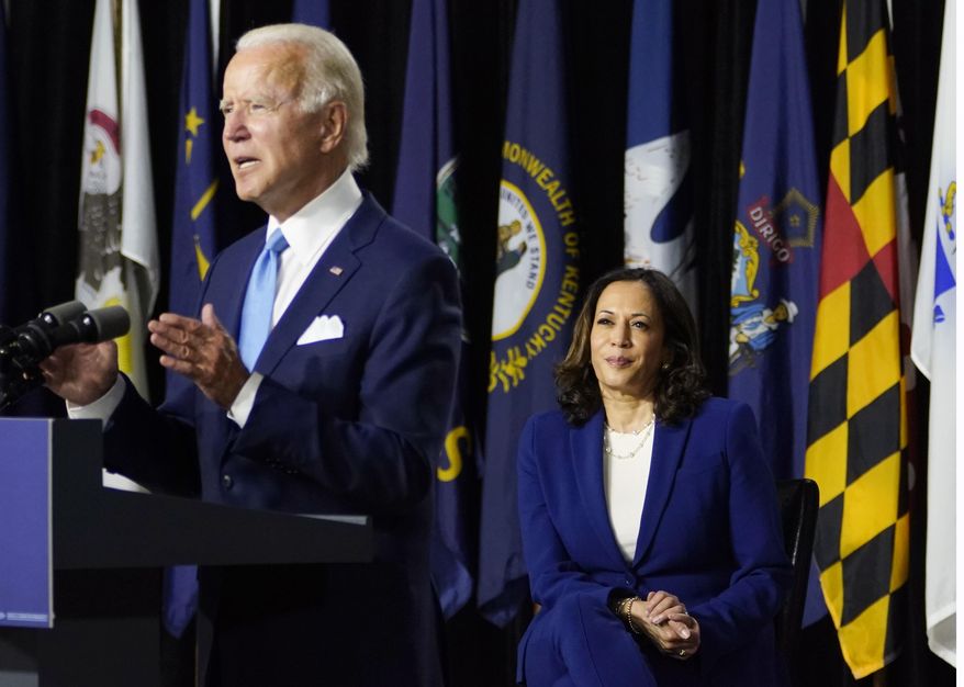 Democratic presidential candidate former Vice President Joe Biden, joined by his running mate Sen. Kamala Harris, D-Calif., speaks during a campaign event at Alexis Dupont High School in Wilmington, Del., Wednesday, Aug. 12, 2020. (AP Photo/Carolyn Kaster) **FILE**