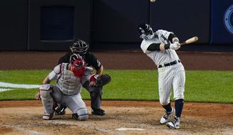 New York Yankees&#39; Clint Frazier hits a three-run home run during the sixth inning of a baseball game against the Boston Red Sox Saturday, Aug. 15, 2020, in New York. (AP Photo/Frank Franklin II)