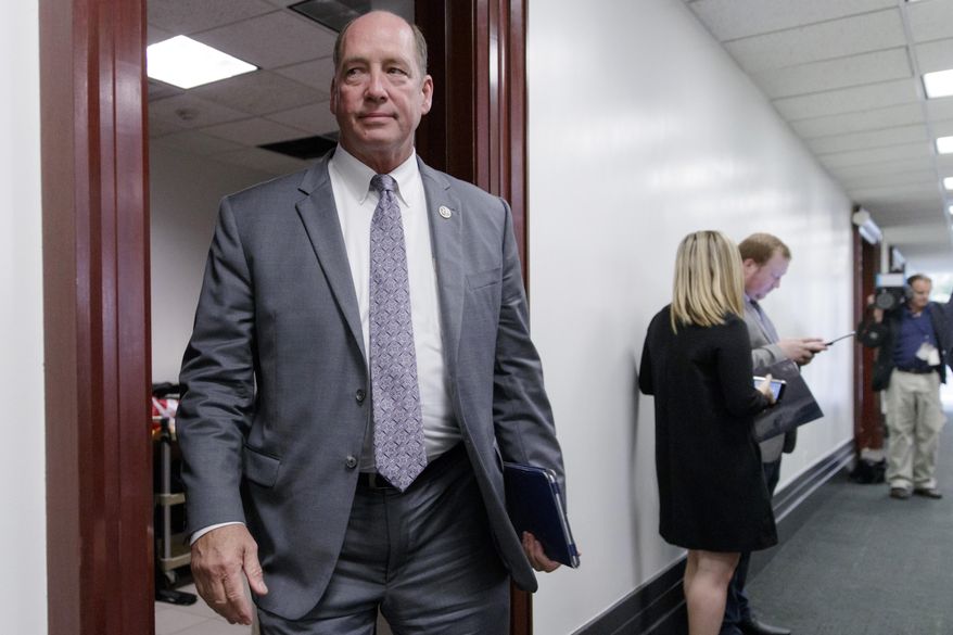 FILE - In this March 28, 2017, file photo, Rep. Ted Yoho, R-Fla., leaves a closed-door strategy session at the Capitol in Washington. Florida will elect at least two new members of Congress this year, and the Republican primaries in two districts will likely decide who they'll be. Republican U.S. Reps. Ted Yoho is leaving office in a heavily GOP district. Yoho' s District 3 stretches from Ocala to just south of Jacksonville. (AP Photo/J. Scott Applewhite, File)