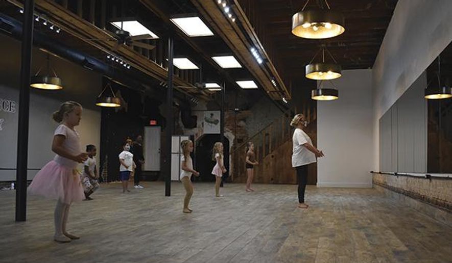 Spencer Ann Brown teaches a ballet class to students at the studio in Salisbury, N.C. (Ben Stansell/The Salisbury Post via AP)ll@salisburypost.com