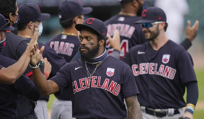 Cleveland Indians center fielder Delino DeShields greets teammates after their 8-5 over the Detroit Tigers in a baseball game, Sunday, Aug. 16, 2020, in Detroit. (AP Photo/Carlos Osorio)