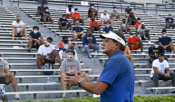 Auburn coach Gus Malzahn talks to players during the first team meeting of the season for the NCAA college football team, Sunday, Aug. 16, 2020, in Auburn, Ala. (AP Photo/Todd Van Emst via AP)