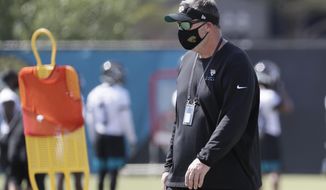 Jacksonville Jaguars head coach Doug Marrone watches players perform drills during an NFL football workout, Thursday, Aug. 13, 2020, in Jacksonville, Fla. (AP Photo/John Raoux)