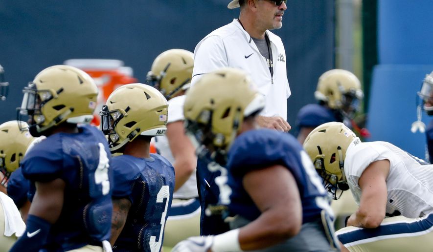 FILE - In this Aug. 9, 2018, file photo, Pittsburgh head coach Pat Narduzzi watches drills during an NCAA college football practice in Pittsburgh. Narduzzi shut down practice for a day last week when several players self-reported symptoms associated with COVID-19. All of them tested negative, but it provided an eye-opening insight into what coaching is like during a pandemic.(AP Photo/Keith Srakocic, File)