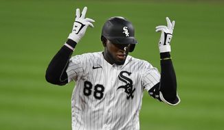 Chicago White Sox&#39;s Luis Robert celebrates while rounding the bases after hitting a two-run home run during the eighth inning of a baseball game against the Detroit Tigers Monday, Aug. 17, 2020, in Chicago. (AP Photo/Paul Beaty)