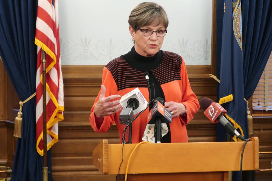 Kansas Gov. Laura Kelly discusses the coronavirus pandemic with reporters during a news conference, Monday, Aug. 17, 2020, at the Statehouse in Topeka, Kan. Kelly says she is reimposing a moratorium on evictions and foreclosures on home mortgages to help people struggling economically because of the pandemic. (AP Photo/John Hanna)