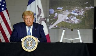 President Donald Trump listens during a briefing on derecho damage and recovery efforts in Iowa, Tuesday, Aug. 18, 2020, in Cedar Rapids, Iowa. (AP Photo/Evan Vucci) **FILE**