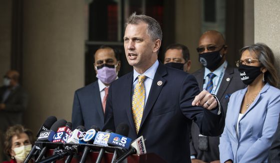 Flanked by other members of the Illinois congressional delegation, U.S. Rep. Sean Casten speaks about the importance of the United States Postal Service during a press conference outside the USPS Chicago Headquarters, Tuesday morning, Aug. 18, 2020. (Ashlee Rezin Garcia/Chicago Sun-Times via AP) ** FILE **