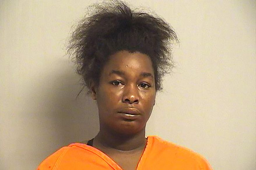 This undated photo provided by the Tulsa County Jail in Tulsa, Okla., shows Donisha Willis. The Oklahoma medical examiners office has ruled that two Tulsa children whose bodies were found in waterways in May 2020, accidentally drowned. Autopsy reports released Friday say both 3-year-old Miracle Crook and her 21-month-old brother, Tony Crook drowned after being last seen on video holding hands and walking through an opening in a chain-link fence toward rain-swollen creek that flows into the Arkansas River. The mother of the children, Willis, has pleaded not guilty to second-degree murder charges in the deaths. (Tulsa County Jail via AP)
