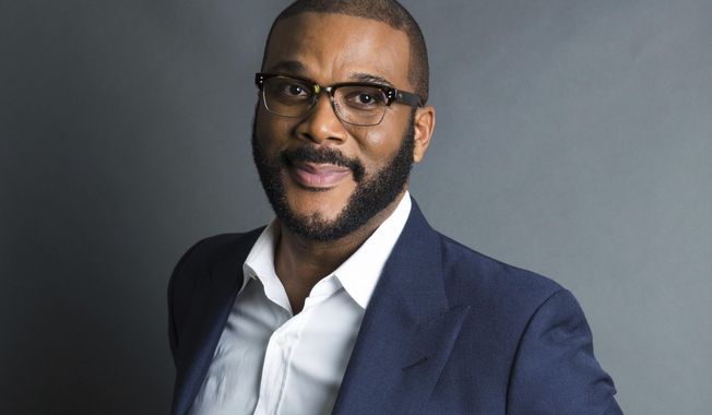 FILE - Actor-filmmaker and author Tyler Perry poses for a portrait in New York on Nov. 16, 2017. Perry has won awards from the NAACP and BET. Now he's getting a big one from the Television Academy. He and his foundation are the recipients of the 2020 Governors Award. (Photo by Amy Sussman/Invision/AP, File)