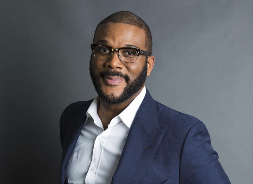 FILE - Actor-filmmaker and author Tyler Perry poses for a portrait in New York on Nov. 16, 2017. Perry has won awards from the NAACP and BET. Now he's getting a big one from the Television Academy. He and his foundation are the recipients of the 2020 Governors Award. (Photo by Amy Sussman/Invision/AP, File)