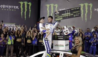  In this Saturday, May 18, 2019, file photo, Kyle Larson celebrates in Victory Lane after winning the NASCAR All-Star Race at Charlotte Motor Speedway in Concord, N.C. Larson has been working behind the scenes to educate himself on racial issues since his firing from NASCAR for using a racial slur. (AP Photo/Chuck Burton, File)  **FILE**
