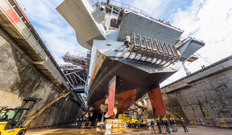 USS Nimitz (CVN 68) in  Dry Dock 6 post dewatering at Puget Sound Naval Shipyard &amp; Intermediate Maintenance Facility in Bremerton, Wash., March 5, 2018. This is the beginning of a nine-month dry dock portion of the Nimitzs Docking Planned Incremental Availability maintenance period. (PSNS &amp; IMF photo by Thiep Van Nguyen II) ** FILE **