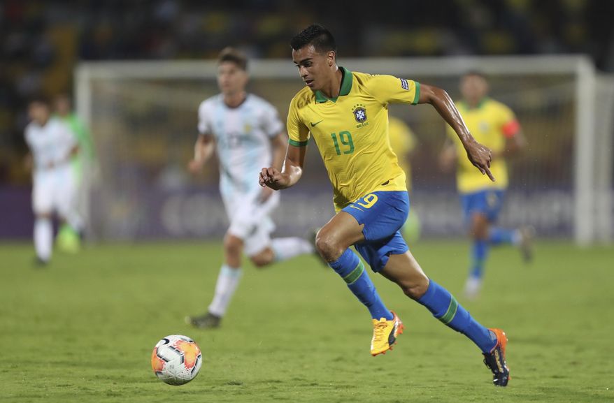 Brazil's Reinier dribbles the ball upfield during a South America Olympic qualifying U23 soccer match against Argentina at the Alfonso Lopez stadium in Bucaramanga, Colombia, Sunday, Feb. 9, 2020. (AP Photo/Fernando Vergara)