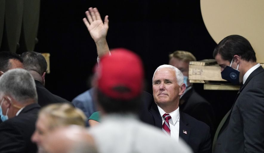 Vice President Mike Pence waves after speaking at the Tankcraft Corporation Wednesday, Aug. 19, 2020, in Darien, Wis. (AP Photo/Morry Gash)