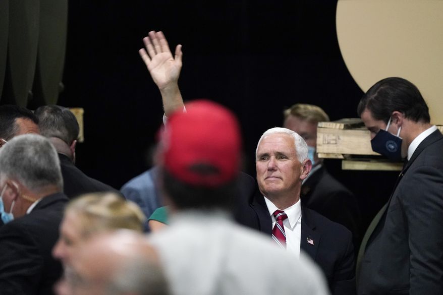 Vice President Mike Pence waves after speaking at the Tankcraft Corporation Wednesday, Aug. 19, 2020, in Darien, Wis. (AP Photo/Morry Gash)