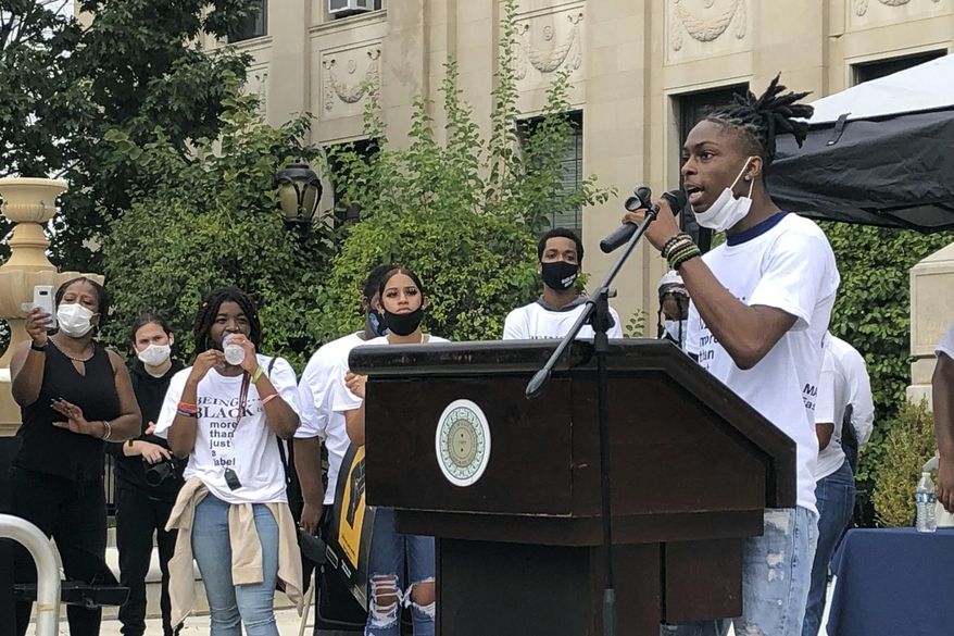 High school senior Okendell Vincent, of East Orange, N.J., speaks at a rally protesting the May 2020 death of Maurice Gordon by the New Jersey State Police, Wednesday, Aug. 19, 2020 in South Orange, N.J. Gordon, a 28-year-old black man, was killed on May 23 in southern New Jersey after he was stopped for speeding. (AP Photo/David Porter)