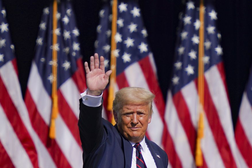 President Donald Trump waves to the audience after speaking at a campaign rally at Mariotti Building Products, Thursday, Aug. 20, 2020, in Old Forge, Pa. (AP Photo/John Minchillo)