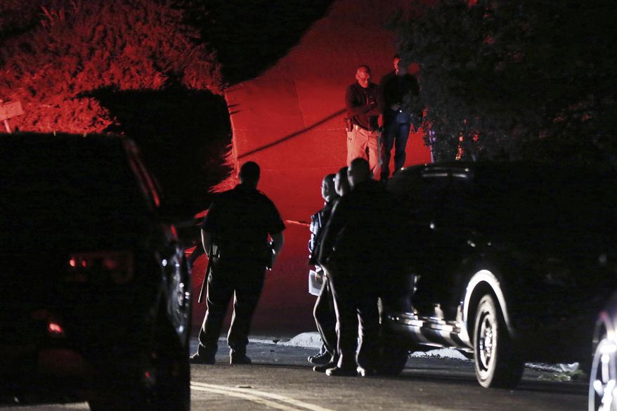 FILE - In this Oct. 31, 2019, file photo, Contra Costa County Sheriff deputies investigate a multiple shooting on Halloween at an Airbnb rental home in Orinda, Calif. Airbnb is banning house parties worldwide as it tries to clean up its reputation and comply with limits on gatherings during the pandemic. The San Francisco-based home sharing company said it will limit occupancy in its rental homes to 16 people. After the deadly shooting at a California Airbnb rental last Halloween, the company has taken multiple steps to crack down on parties. (Ray Chavez/East Bay Times via AP, File)