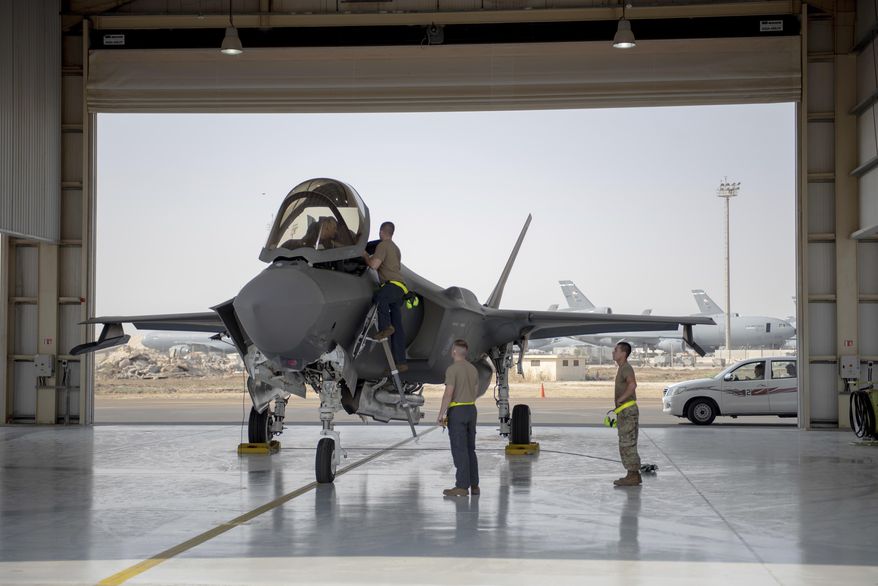 In this Aug. 5, 2019, photo released by the U.S. Air Force, an F-35 fighter jet pilot and crew prepare for a mission at Al-Dhafra Air Base in the United Arab Emirates. (Staff Sgt. Chris Thornbury/U.S. Air Force via AP) **FILE**