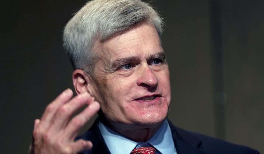 In this July 24, 2020, file photo, Sen. Bill Cassidy, R-La., delivers remarks to media after registering as a candidate to run as an incumbent in Baton Rouge, La. (AP Photo/Gerald Herbert)