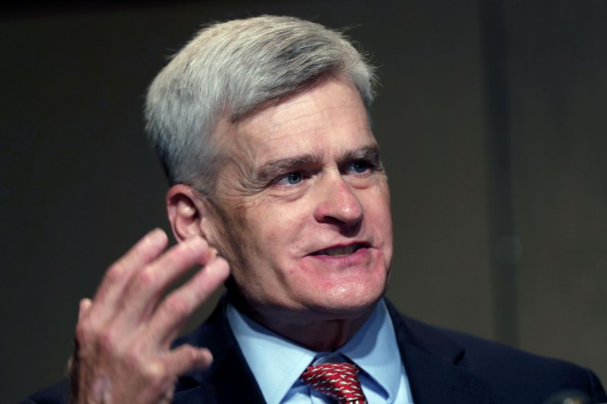 In this July 24, 2020, file photo, Sen. Bill Cassidy, R-La., delivers remarks to media after registering as a candidate to run as an incumbent in Baton Rouge, La. (AP Photo/Gerald Herbert)