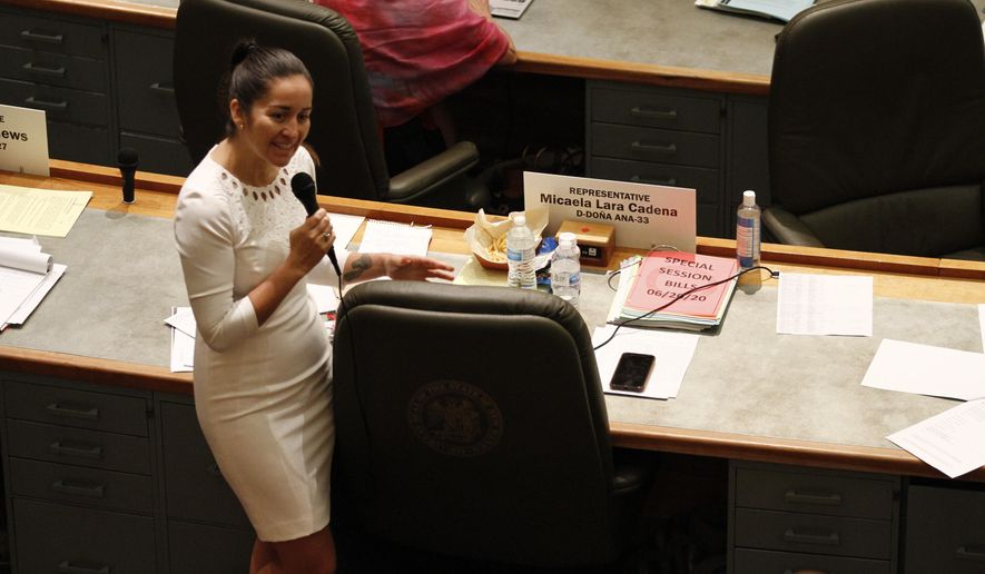 ADDS FIRST NAME MICAELA - Rep. Micaela Lara Cadena, of Doña Ana County, debates a fellow Democrat about a police body camera bill she sponsored during a special session Monday, June 22, 2020, in Santa Fe, New Mexico. The bill passed, and if signed by the governor would require police departments to retain body camera video for 120 days or face the possibility of being sued for withholding evidence. (AP Photo/Cedar Attanasio)