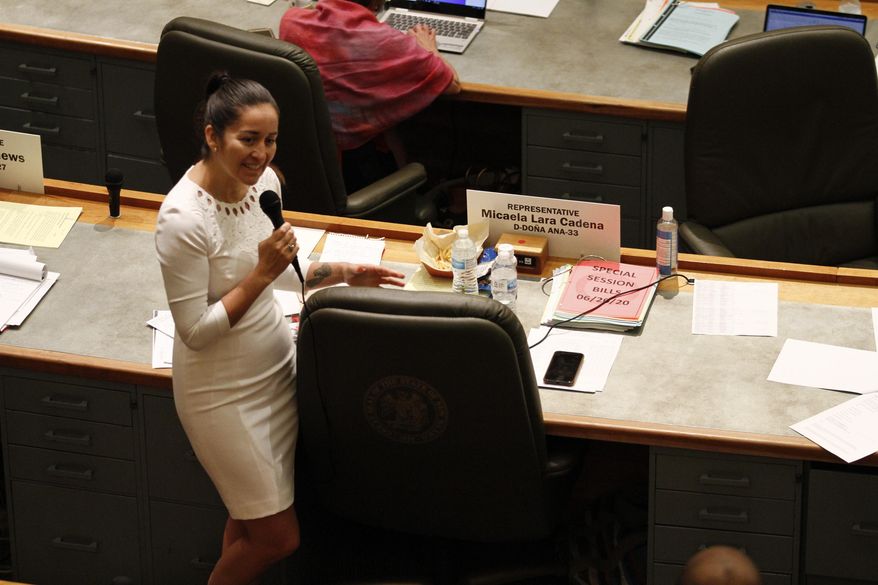 ADDS FIRST NAME MICAELA - Rep. Micaela Lara Cadena, of Doña Ana County, debates a fellow Democrat about a police body camera bill she sponsored during a special session Monday, June 22, 2020, in Santa Fe, New Mexico. The bill passed, and if signed by the governor would require police departments to retain body camera video for 120 days or face the possibility of being sued for withholding evidence. (AP Photo/Cedar Attanasio)