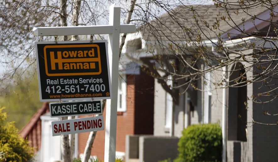 This Monday, April 27, 2020, file photo shows a sale pending sign on a home in Mount Lebanon, Pa. The coronavirus pandemic helped shape the housing market by influencing everything from the direction of mortgage rates to the inventory of homes on the market to the types of homes in demand and the desired locations. (AP Photo/Gene J. Puskar, File)  **FILE**