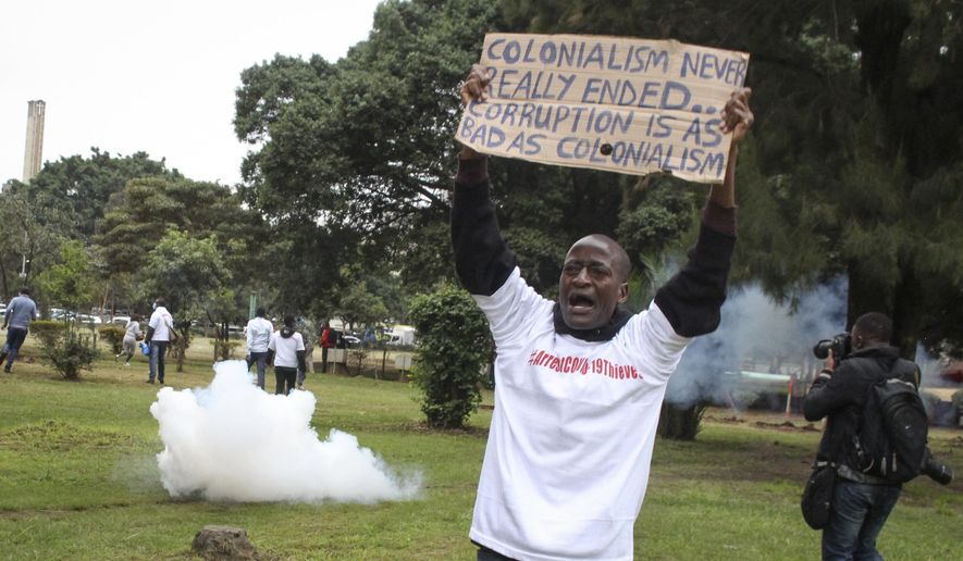 Demonstrators run from teargas fired by police at a protest against alleged corruption, including the theft of supplies for the fight against the coronavirus, at Uhuru Park in downtown Nairobi, Kenya Friday, Aug. 21, 2020. Kenya&#39;s police teargassed and arrested some of the protesters who were holding a peaceful demonstration following the announcement that the country&#39;s anti-corruption agency is investigating the theft of millions of dollars of supplies from the Kenya Medical Supplies Authority. (AP Photo)