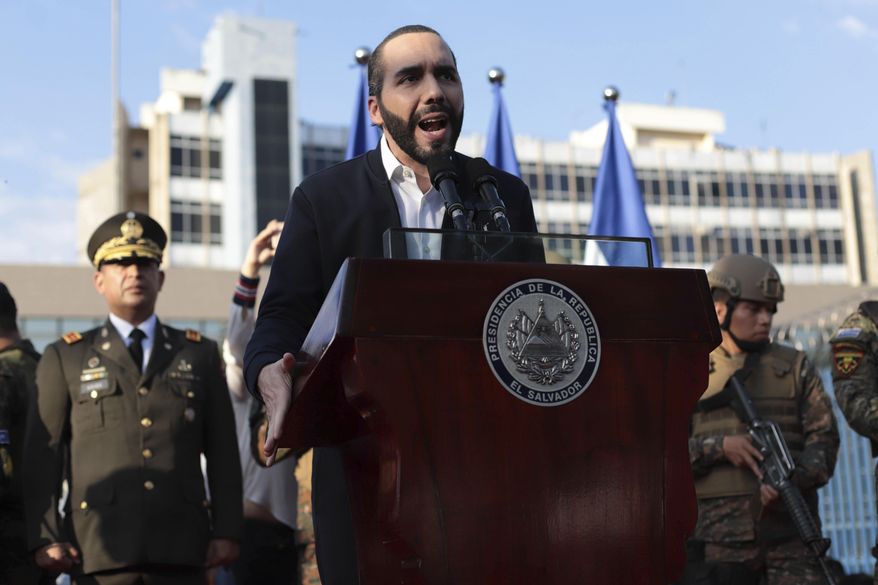 FILE - In this Feb. 9, 2020 file photo, El Salvador&#39;s President Nayib Bukele, accompanied by members of the armed forces, speaks to supporters outside Congress in San Salvador, El Salvador. Bukele has imposed some of the region&#39;s toughest measures against the new coronavirus and a growing number of human rights advocates at home and abroad complain the 38-year-old leader has used the emergency to seize near-dictatorial powers. (AP Photo/Salvador Melendez, File)