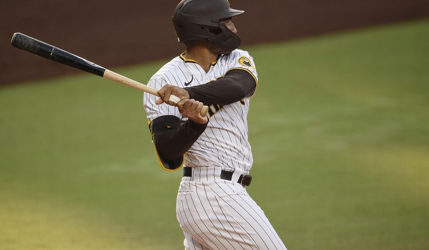 San Diego Padres' Trent Grisham follows through on a three-run home run during the second inning of the team's baseball game against the Houston Astros in San Diego, Saturday, Aug. 22, 2020. (AP Photo/Kelvin Kuo)