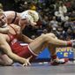 FILE - In this Jan. 2, 2019, file photo, Penn State&#39;s Bo Nickal, rear left, wrestles with Stanford&#39;s Nathan Traxler in the 197-pound championship bout of the Southern Scuffle wrestling tournament in Chattanooga, Tenn. Stanford announced Wednesday, July 8, 2020,  that it is dropping 11 sports amid financial difficulties caused by the coronavirus pandemic. The school will discontinue men’s and women’s fencing, field hockey, lightweight rowing, men’s rowing, co-ed and women’s sailing, squash, synchronized swimming, men’s volleyball and wrestling after the 2020-21 academic year. Stanford also is eliminating 20 support staff positions.(C.B. Schmelter/Chattanooga Times Free Press via AP, File)