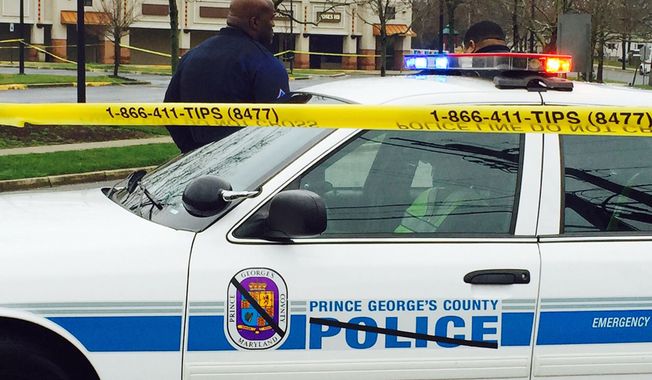 Prince George&#x27;s County police block the road to the police station, Monday morning.  (AP File Photo/Jessica Gresko)