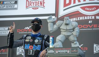Kevin Harvick celebrates after winning a NASCAR Cup Series auto race at Dover International Speedway, Sunday, Aug. 23, 2020, in Dover, Del. (AP Photo/Jason Minto)