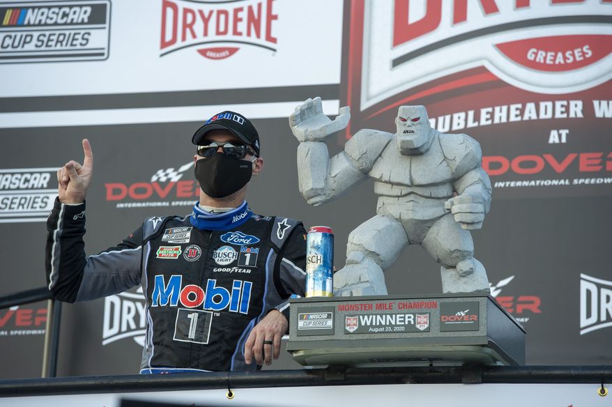 Kevin Harvick celebrates after winning a NASCAR Cup Series auto race at Dover International Speedway, Sunday, Aug. 23, 2020, in Dover, Del. (AP Photo/Jason Minto)