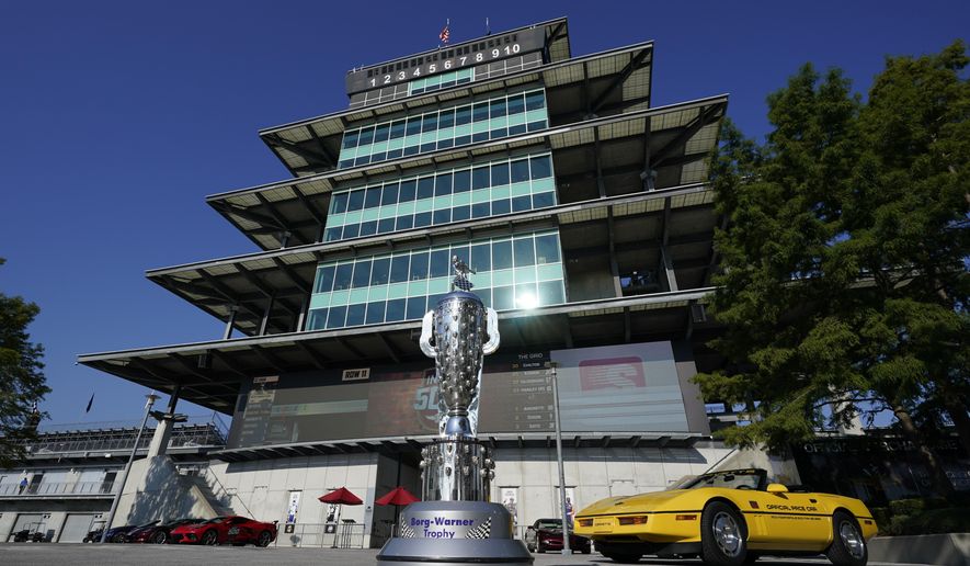 The Borg-Warner Trophy complete with a checkered flag mask, is displayed outside of the Pagoda before the Indianapolis 500 auto race at Indianapolis Motor Speedway, Sunday, Aug. 23, 2020, in Indianapolis.(AP Photo/Darron Cummings)