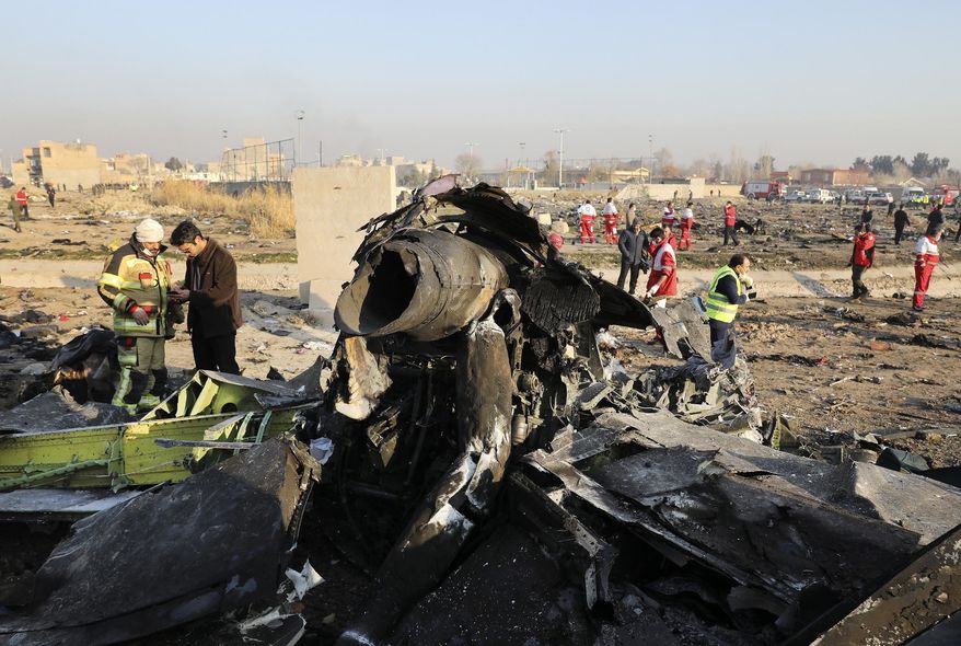 This Jan. 8, 2020, file photo shows debris at the scene where a Ukrainian plane crashed in Shahedshahr southwest of the capital Tehran, Iran. Iran has retrieved some data, including a portion of cockpit conversations, from the Ukrainian jetliner accidentally downed by the Revolutionary Guard forces in January, killing all 176 people on board, an Iranian official said Sunday, Aug. 23, 2020. (AP Photo/Ebrahim Noroozi, File)