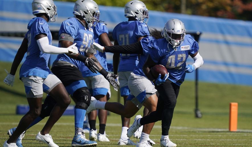 Detroit Lions safety Jalen Elliott (42) runs through a drill at the Lions NFL football camp practice, Saturday, Aug. 22, 2020, in Allen Park, Mich. (AP Photo/Carlos Osorio)