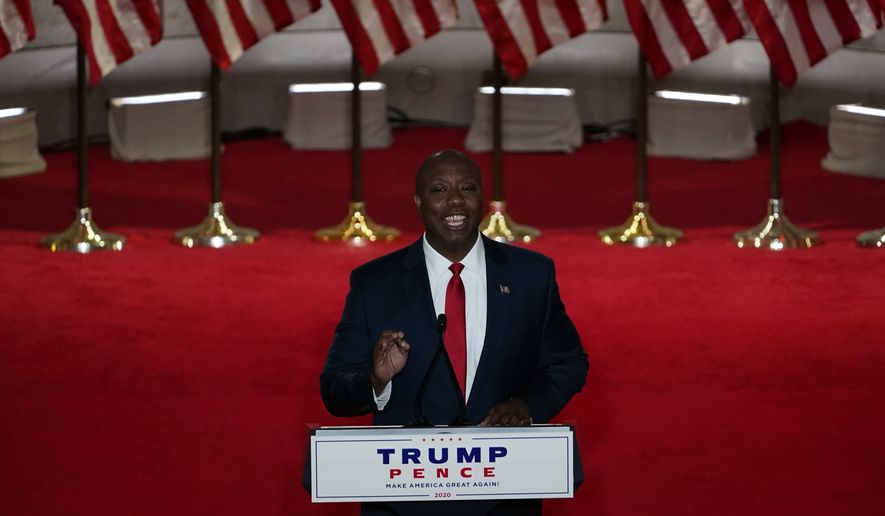 Sen. Tim Scott, R-S.C., speaks during the first night of the Republican National Convention from the Andrew W. Mellon Auditorium in Washington, Monday, Aug. 24, 2020. (AP Photo/Susan Walsh)