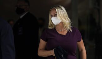 Margaret Hunter, the wife of former California Republican Rep. Duncan Hunter, leaves a federal building Monday, Aug. 24, 2020, in San Diego. She was sentenced Monday in federal court to eight months of home confinement in the corruption case that ended her husband&#39;s career. (AP Photo/Gregory Bull)