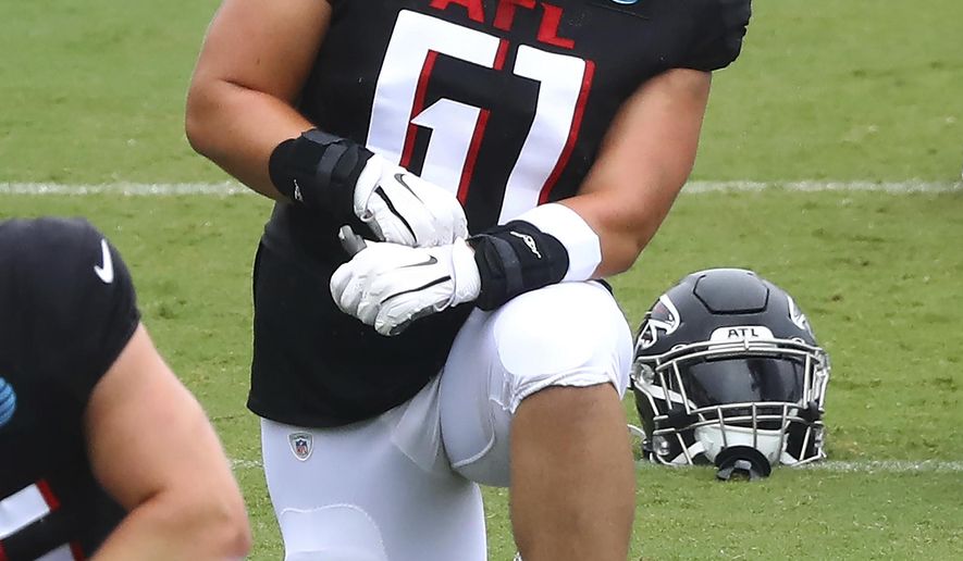Atlanta Falcons rookie center Matt Hennessy loosens up during an NFL football training camp practice in Flowery Branch, Ga., Monday, Aug. 24, 2020. (Curtis Compton/Atlanta Journal-Constitution via AP, Pool)