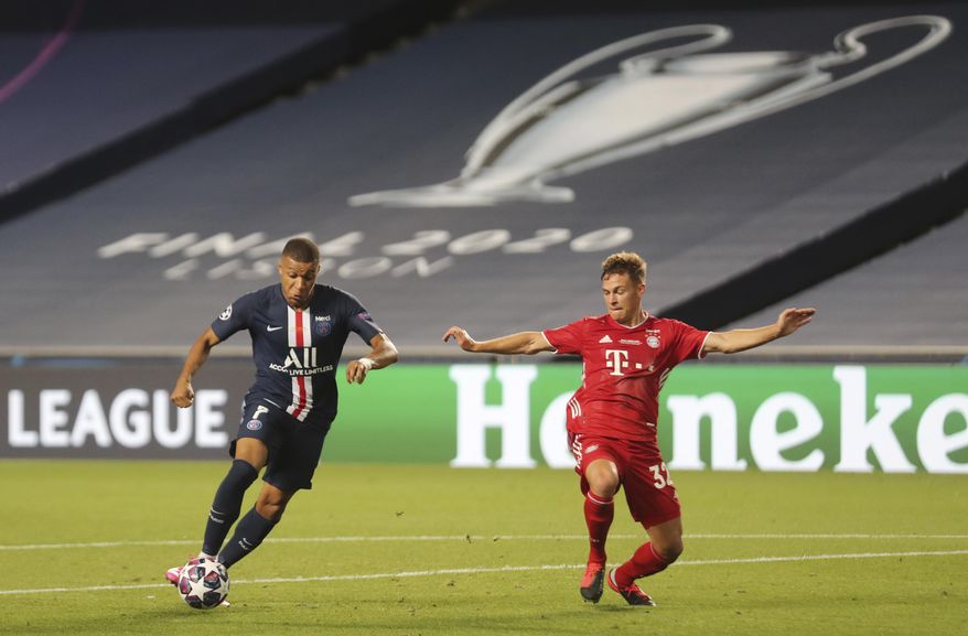 Bayern's Joshua Kimmich, right, challenges PSG's Kylian Mbappe during the Champions League final soccer match between Paris Saint-Germain and Bayern Munich at the Luz stadium in Lisbon, Portugal, Sunday, Aug. 23, 2020. (Miguel A. Lopes/Pool via AP)