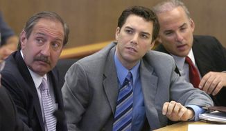 Scott Peterson, center, with defense attorneys Mark Geragos, left, and Pat Harris listens to judge Alfred A. Delucchi in a Redwood City, Calif., courtroom, Thursday, July 29, 2004. On Monday, August 24, 2020, the California Supreme Court overturned the 2005 death sentence for Peterson in the slaying of his pregnant wife. The court says prosecutors may try again for the same sentence if they wish in the high-profile case. It upheld his 2004 conviction of murdering Laci Peterson, who was eight months pregnant with their unborn son. (Al Golub/The Modesto Bee,Pool)