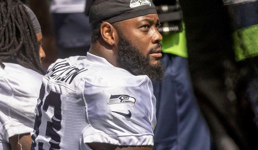 Seattle Seahawks defensive end Branden Jackson looks on before a mock NFL football game in Seattle Saturday, Aug. 22, 2020. (Bettina Hansen/The Seattle Times via AP)