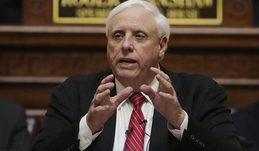 In this file photo, West Virginia Gov. Jim Justice delivers his annual State of the State address in the House Chambers at the state capitol in Charleston, W.Va., Wednesday,  Jan. 8, 2020. Nursing home visits are being allowed again in West Virginia as the state focuses on coronavirus outbreaks in the general populations of individual counties without clamping down on areas without them. Justice warned Monday, Aug. 24, 2020, that the visits could end quickly in some places if further outbreaks occur within nursing homes themselves. (AP Photo/Chris Jackson, File)  **FILE**