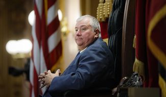 FILE - In this Wednesday, Oct. 30, 2019, file photo, then-Republican Ohio state Rep. Larry Householder, of District 72, sits at the head of a legislative session as Speaker of the House, in Columbus. With their presidential hopes high for fall, some Ohio Democrats, who helped seat Householder, the now-indicted Republican House speaker, and also helped pass the nuclear bailout bill that prosecutors allege Householder delivered as part of a $61 million bribery scheme, have begun shedding campaign contributions tainted by the related federal probe. (AP Photo/John Minchillo, File)