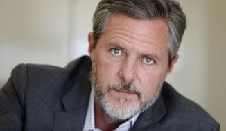 In this Nov. 16, 2016 file photo, Liberty University President Jerry Falwell Jr., pauses during an interview in his office at the school in Lynchburg, Va. (AP Photo/Steve Helber, File)  **FILE**