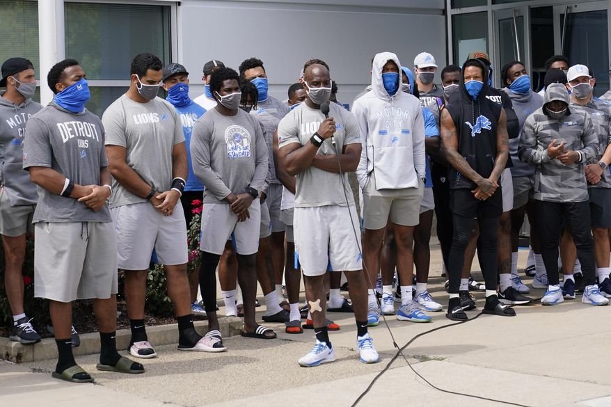 Detroit Lions safety Duron Harmon addresses the media with his teammates outside the Lions NFL football camp practice facility, Tuesday, Aug. 25, 2020, in Allen Park, Mich. The players were reacting to the recent shooting of Jacob Blake in Kenosha, Wis., on Sunday. (AP Photo/Carlos Osorio)