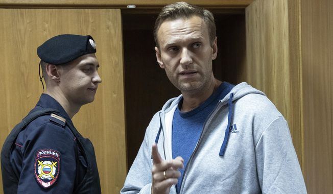 In this Monday, Aug. 27, 2018, file photo, Russian opposition leader Alexei Navalny gestures while speaking in a courtroom in Moscow, Russia. (AP Photo/Pavel Golovkin, File)